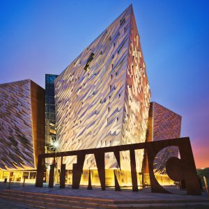 Sunset over Titanic Belfast - museum, touristic attraction and monument to Belfast's maritime heritage on the site of the former Harland and Wolff shipyard.