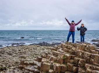 Mother and son at Giants causeway in autumn, Northern Ireland