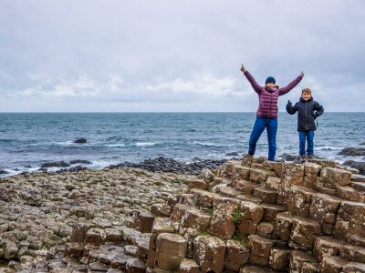 Mother and son at Giants causeway in autumn, Northern Ireland